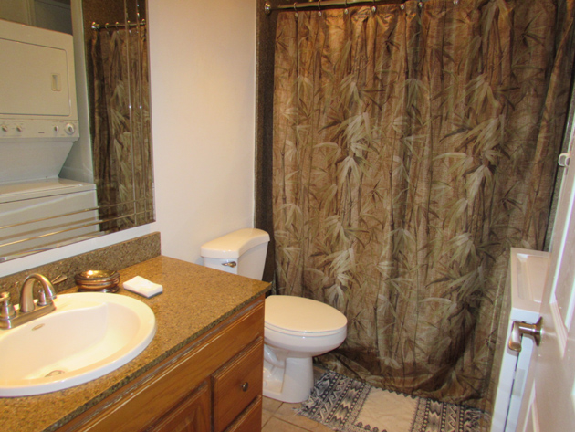 Bathroom with beautiful granite counter and walls.