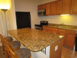 Kitchen with beautiful granite counter tops.